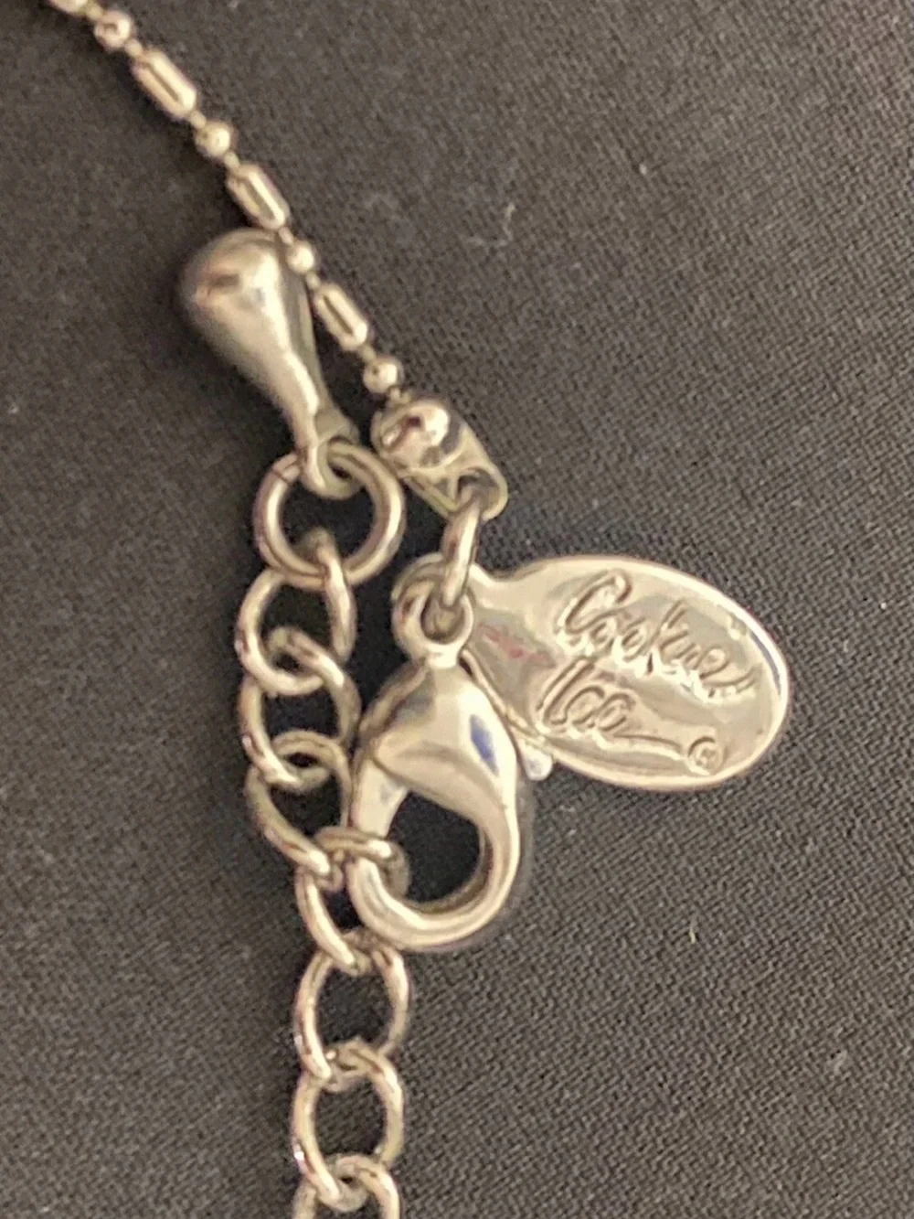 Coach pendant flip